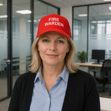 Load image into Gallery viewer, Person wearing a red 'FIRE WARDEN' cap in an office setting
