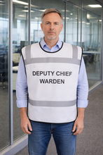 Load image into Gallery viewer, Man wearing a white safety tabbard style vest with DEPUTY CHIEF WARDEN' text in an office setting
