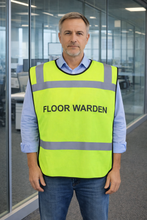 Load image into Gallery viewer, Man wearing a yellow safety tabbard style vest with 'FLOOR WARDEN' text in an office setting
